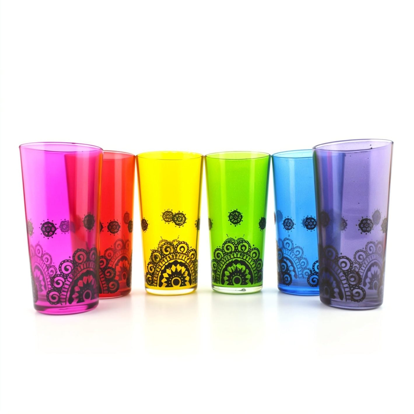Six jewel-tone henna tea cups with hand-painted black mandala patterns arranged in a gentle arc Six jewel-tone henna tea cups with hand-painted black mandala patterns arranged in a gentle arc