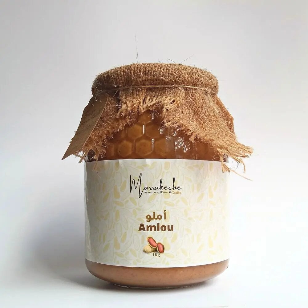 Amlou butter 1kg jar with rustic burlap cover and cream label featuring peanuts, traditional Moroccan spread