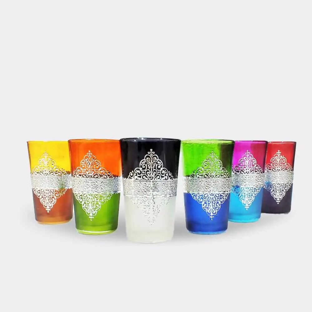 Six silver arabesque tea glasses in multicolor ombré glass, arranged in a row on white background Six silver arabesque tea glasses in multicolor ombré glass, arranged in a row on white background