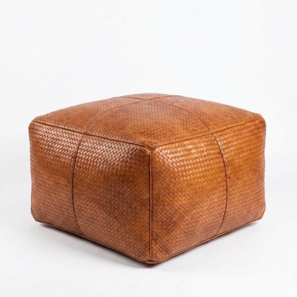 Braided leather square ottoman in cognac with herringbone weave pattern on white background