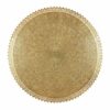 Close-up of hand-engraved brass filigree wall lamp showing arabesque floral patterns and scalloped decorative edge