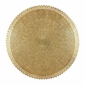 Close-up of hand-engraved brass filigree wall lamp showing arabesque floral patterns and scalloped decorative edge Close-up of hand-engraved brass filigree wall lamp showing arabesque floral patterns and scalloped decorative edge