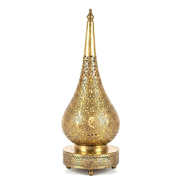 Teardrop brass table lamp with hand-engraved filigree floral patterns on decorative perforated base against white backgr Teardrop brass table lamp with hand-engraved filigree floral patterns on decorative perforated base against white background
