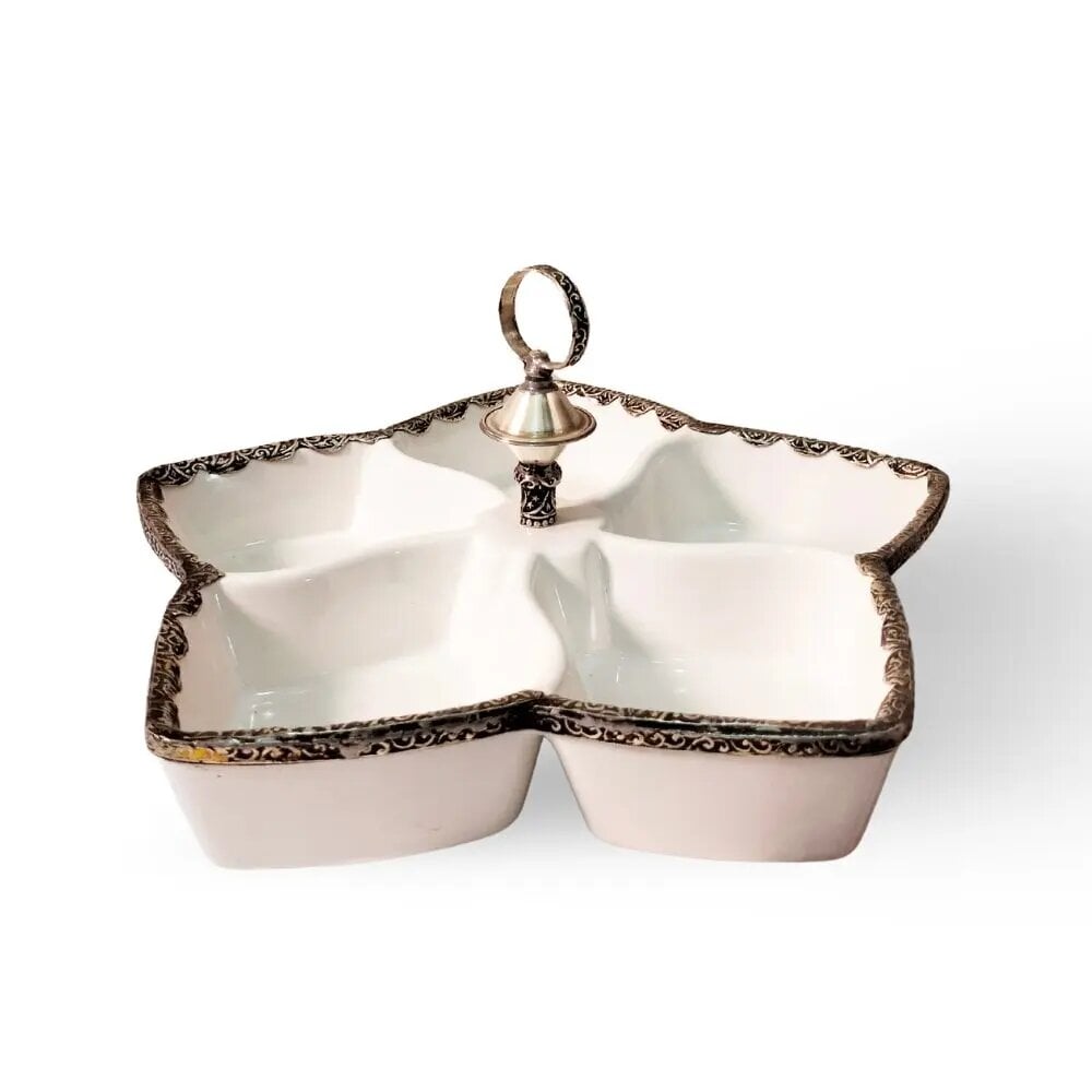White ceramic divided plate with ornate silver handle and 5 compartments for elegant serving White ceramic divided plate with ornate silver handle and 5 compartments for elegant serving
