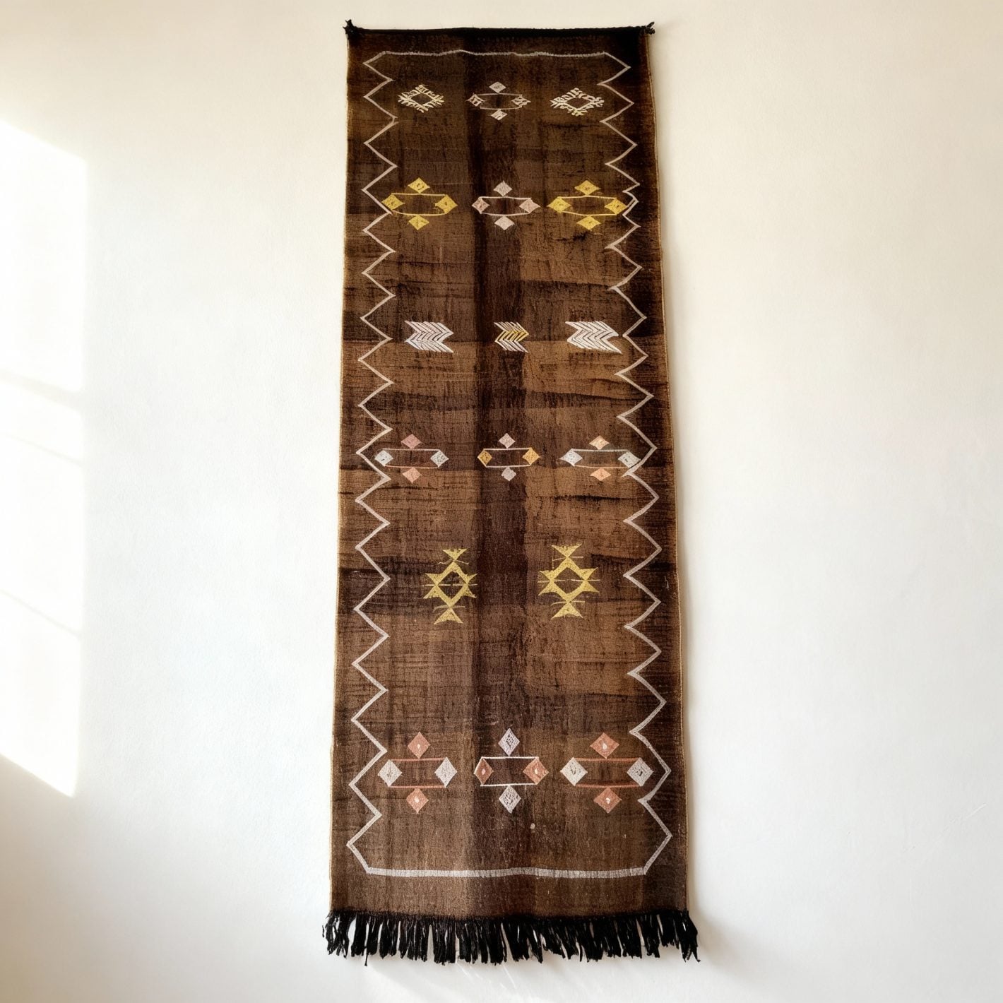 Brown cactus silk runner rug with handwoven Berber diamond patterns and fringe tassels Brown cactus silk runner rug with handwoven Berber diamond patterns and fringe tassels