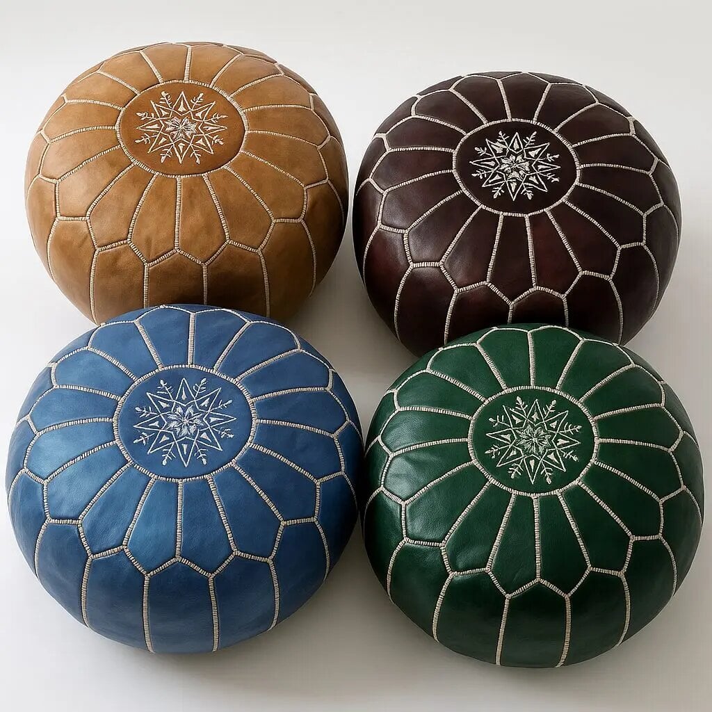 Round leather pouf set of 4 in camel, espresso, blue, and emerald with white embroidered stars on a white backdrop.