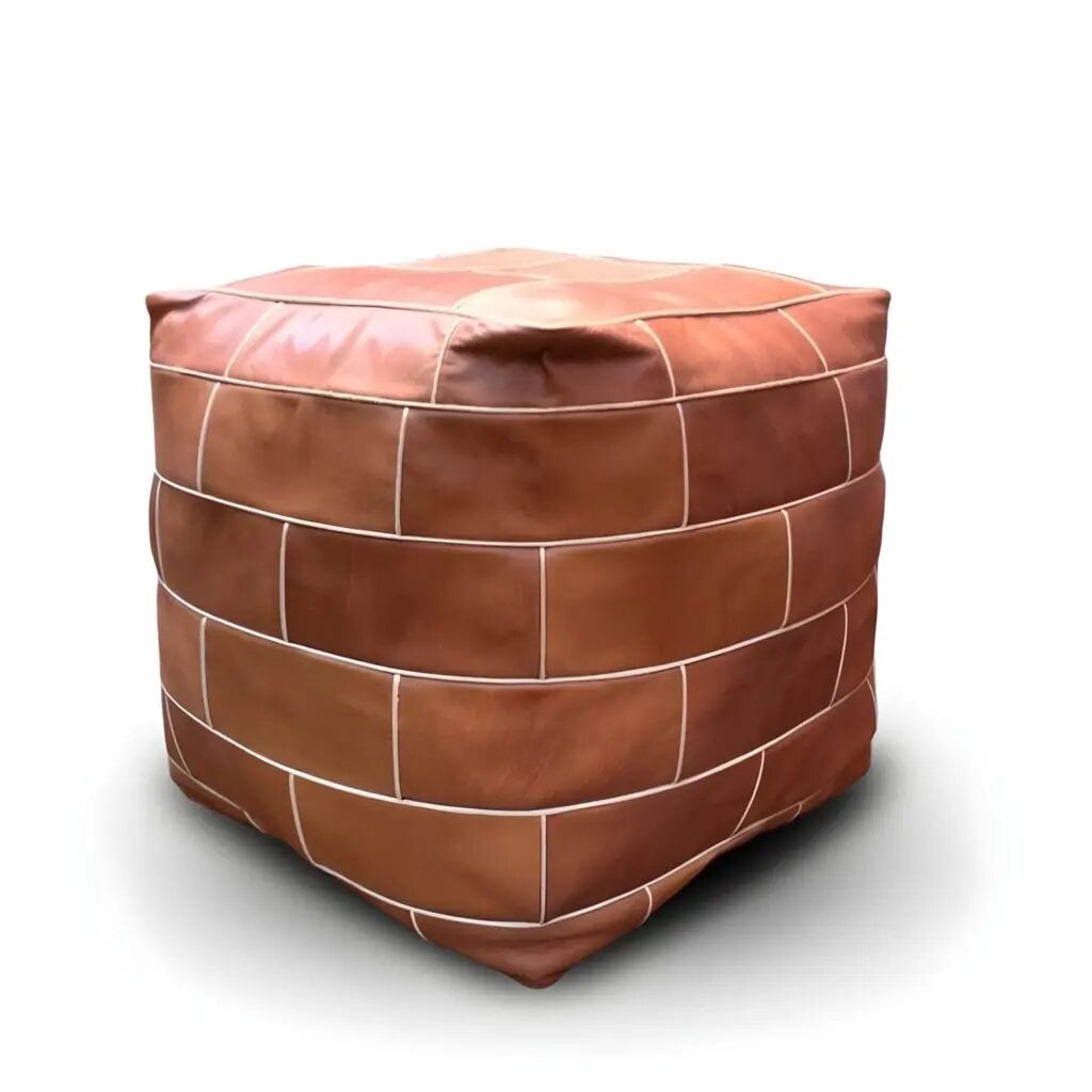 Light brown leather cube pouf with geometric patchwork and cream stitching, handcrafted Moroccan ottoman Light brown leather cube pouf with geometric patchwork and cream stitching, handcrafted Moroccan ottoman
