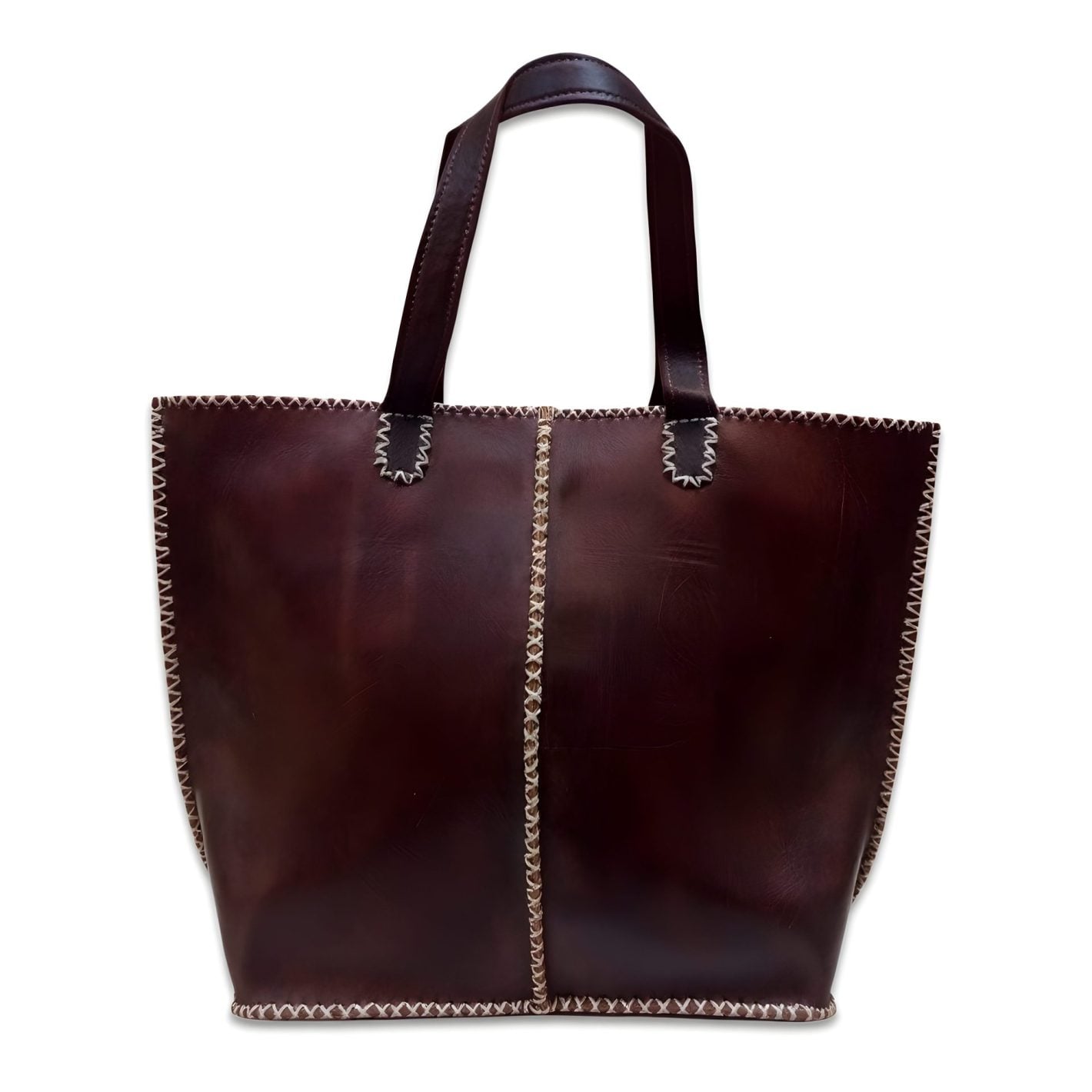 Dark brown leather tote bag with contrast zigzag whipstitch and curved double handles on white background