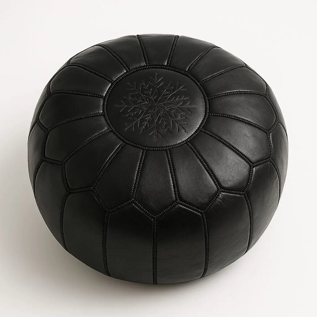 Black leather round pouf with handcrafted geometric star stitching on white background
