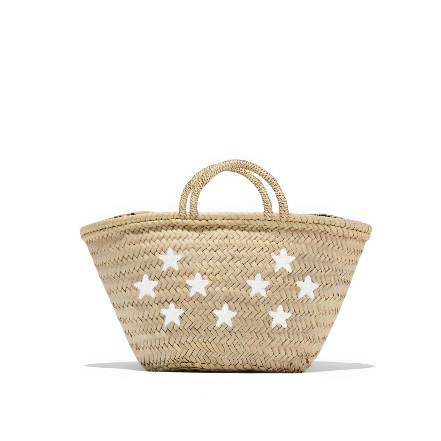 Carry artisan Moroccan craftsmanship with this handwoven palm leaf tote featuring scattered white star appliqués by artisan Dounia. (122) ✓