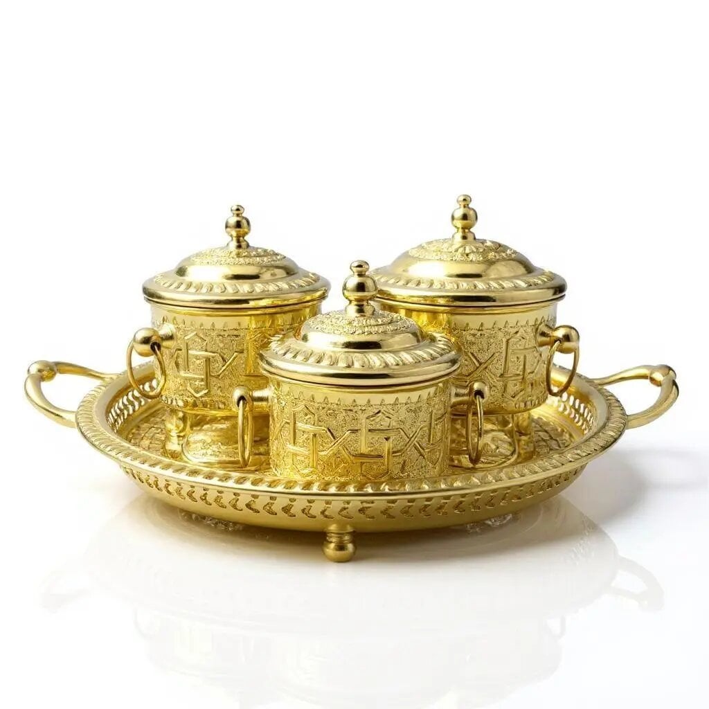 Hand-engraved visible sugar bowl set with three lidded containers on an ornate scalloped serving tray, polished gold fin Hand-engraved visible sugar bowl set with three lidded containers on an ornate scalloped serving tray, polished gold finish