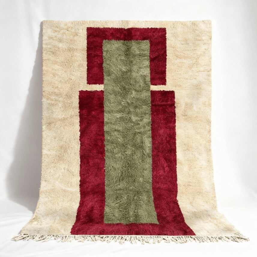 Burgundy sage Berber wool rug with geometric design, cream background and visible fringe detail