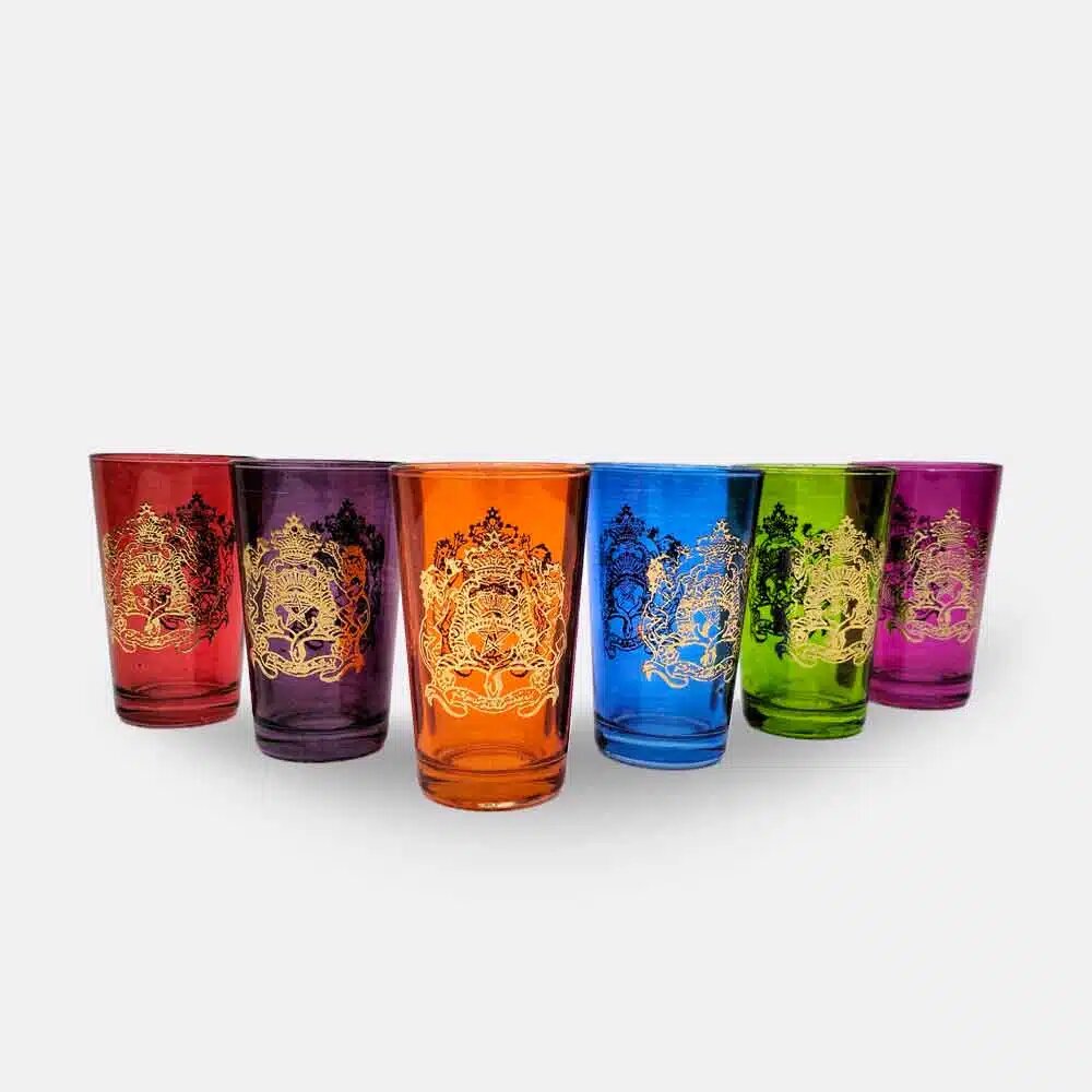 Set of six multicolor gold emblem tea glasses with hand-painted royal crests arranged on white background Set of six multicolor gold emblem tea glasses with hand-painted royal crests arranged on white background