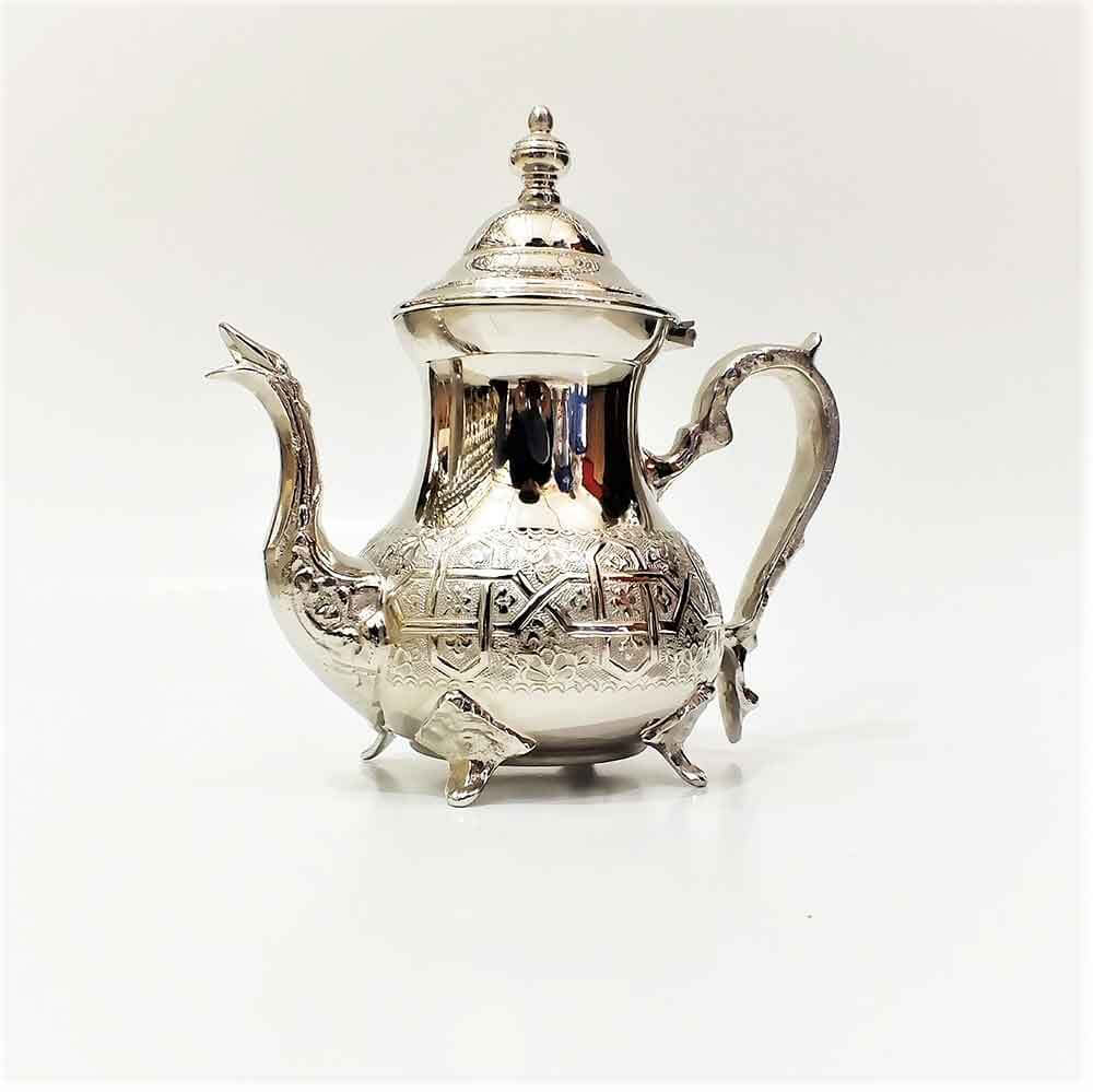 Tall Moroccan silver teapot hand-engraved with geometric patterns, silver-plated brass body with gooseneck spout and dom Tall Moroccan silver teapot hand-engraved with geometric patterns, silver-plated brass body with gooseneck spout and domed finial lid