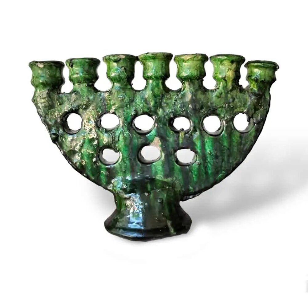 Green Tamegroute ceramic candle holder menorah with 7 branches, handmade with glossy drip glaze and pedestal base Green Tamegroute ceramic candle holder menorah with 7 branches, handmade with glossy drip glaze and pedestal base