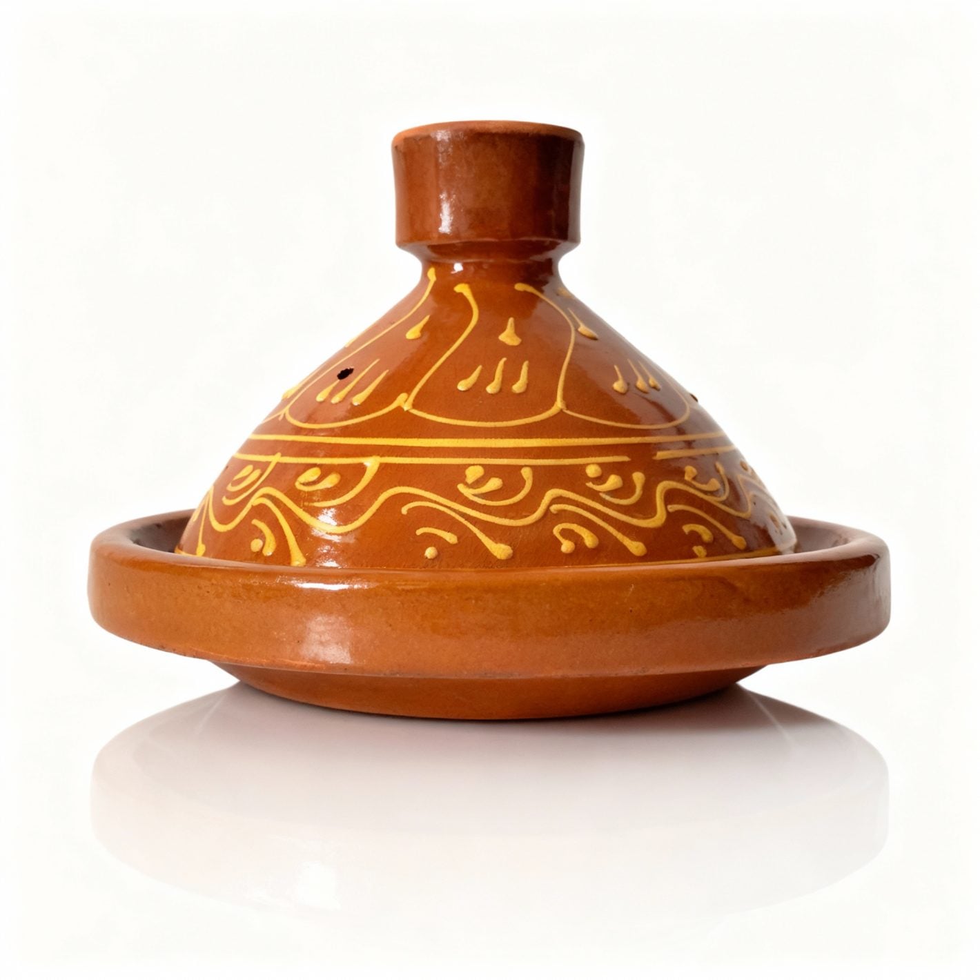 Hand-painted terracotta tagine pot with golden scrollwork patterns on conical lid, traditional ceramic clay cookware Hand-painted terracotta tagine pot with golden scrollwork patterns on conical lid, traditional ceramic clay cookware