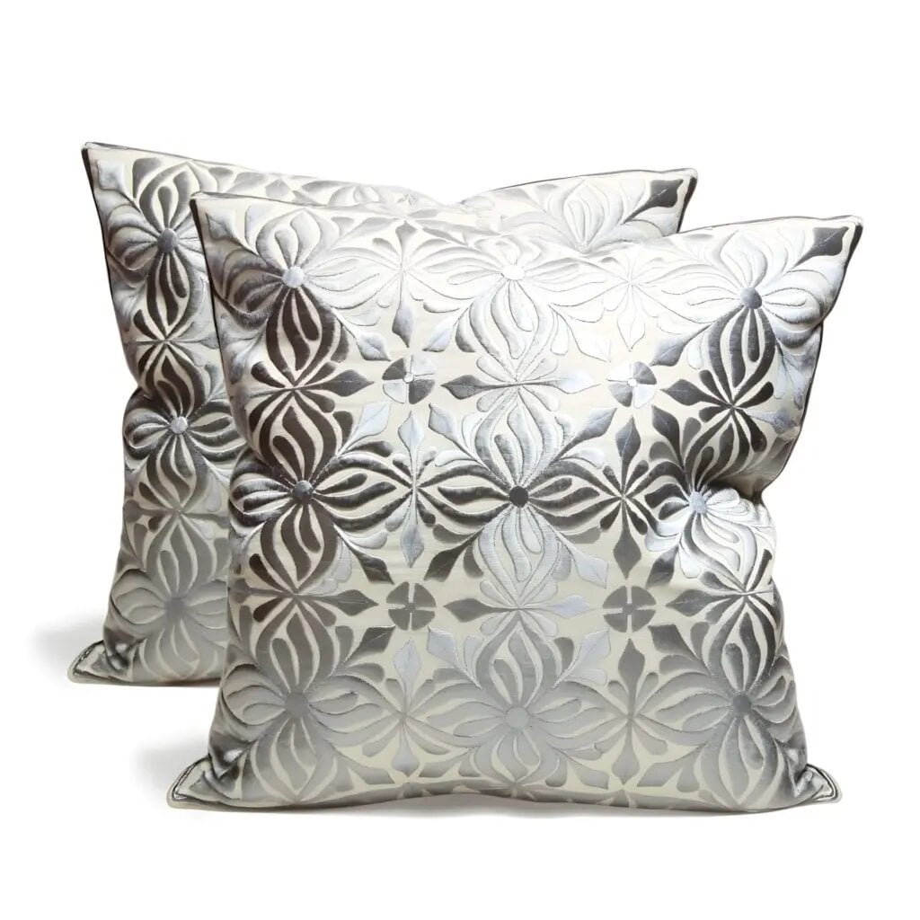 Gray floral pillow covers with dimensional embroidered flowers on cream cotton-silk fabric