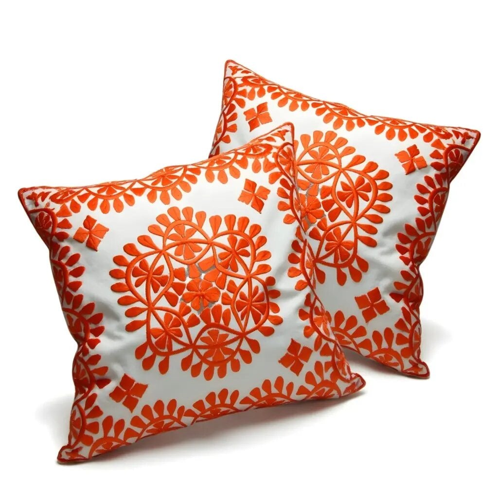 Orange damask embroidered cotton cushion set with intricate floral medallion design on white background Orange damask embroidered cotton cushion set with intricate floral medallion design on white background