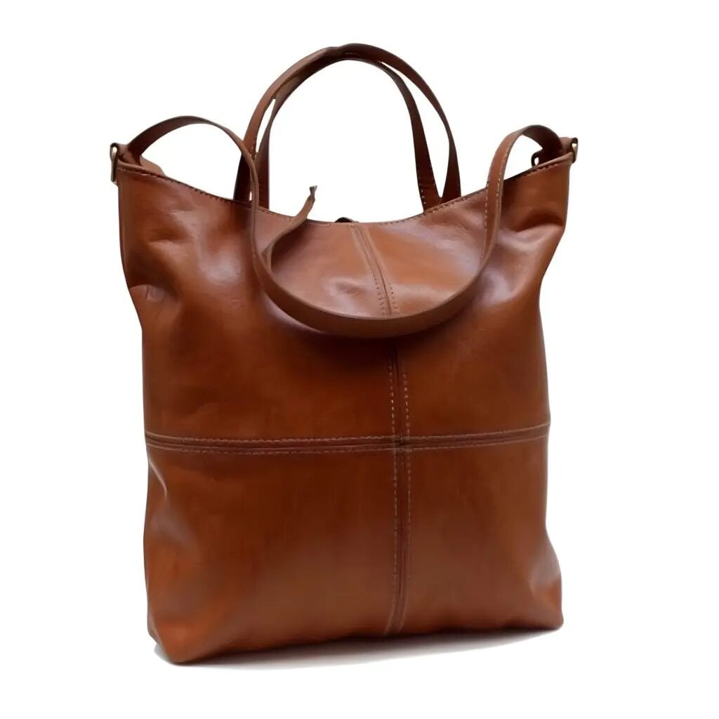 Cognac leather hobo handbag with curved dual handles and contrast stitching on white background