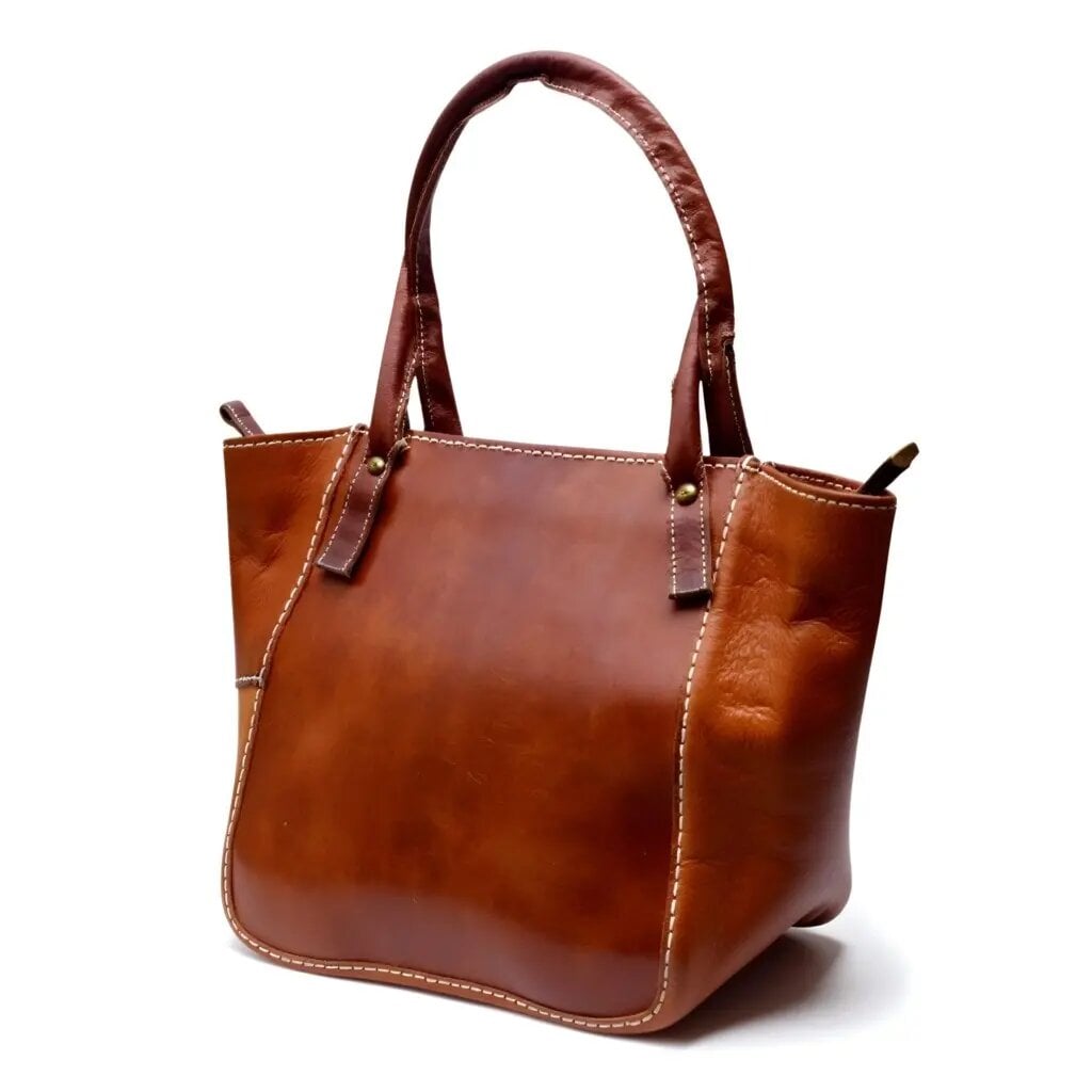 Brown leather tote bag with zipper, cognac body and dark handles with contrast saddle stitching