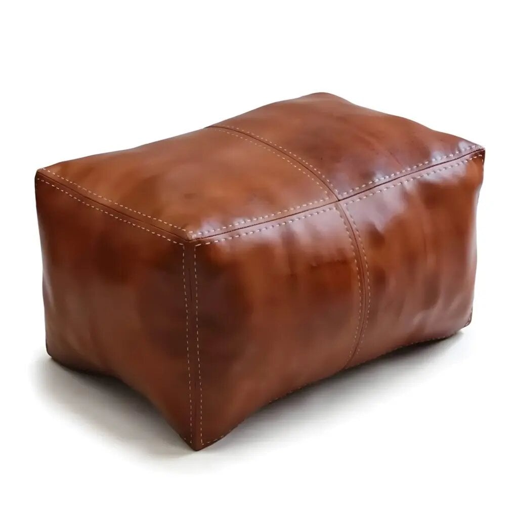 Rectangular leather ottoman in warm brown with hand-stitched cream seams on white background