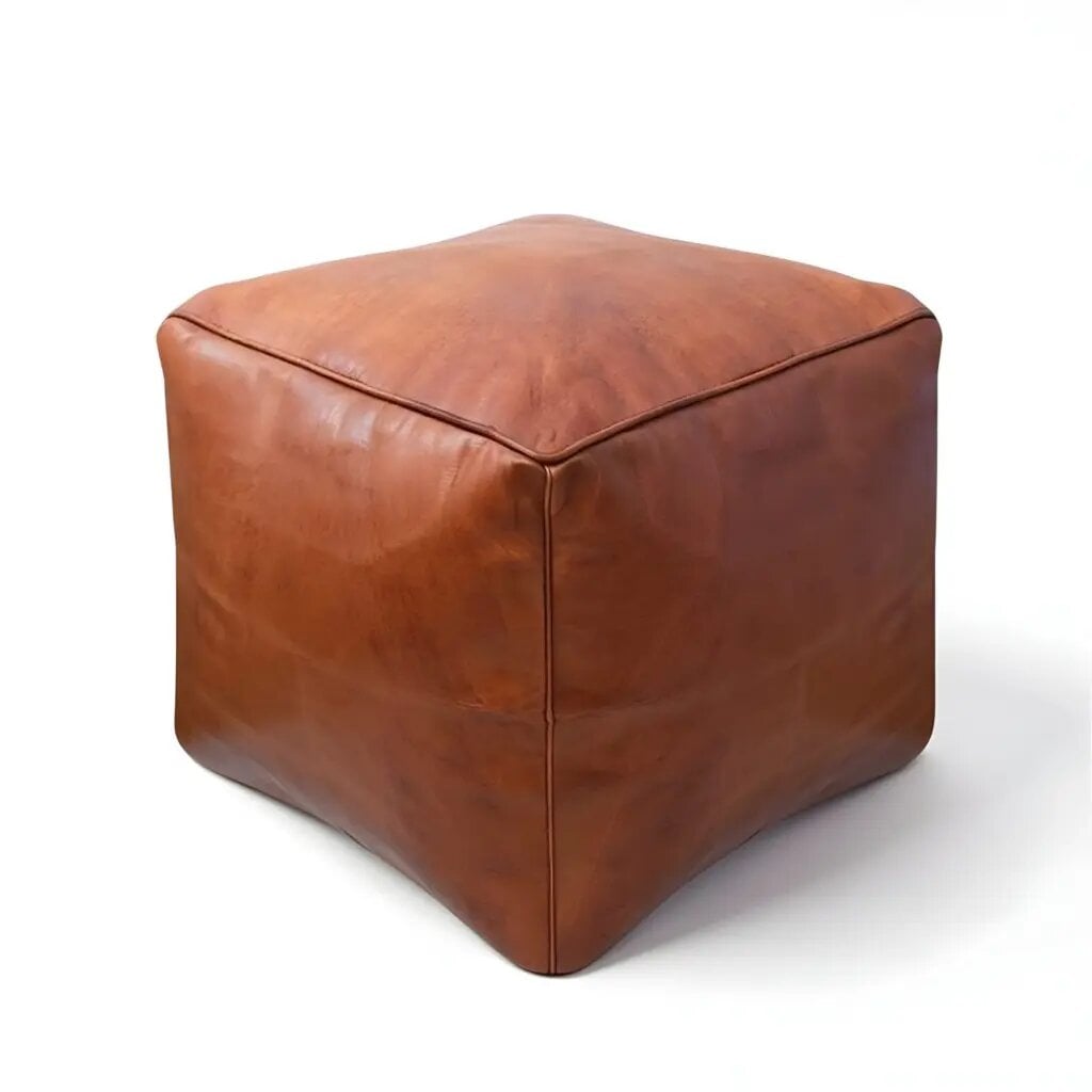 Cognac square leather pouf on white background showing natural grain texture and soft edges