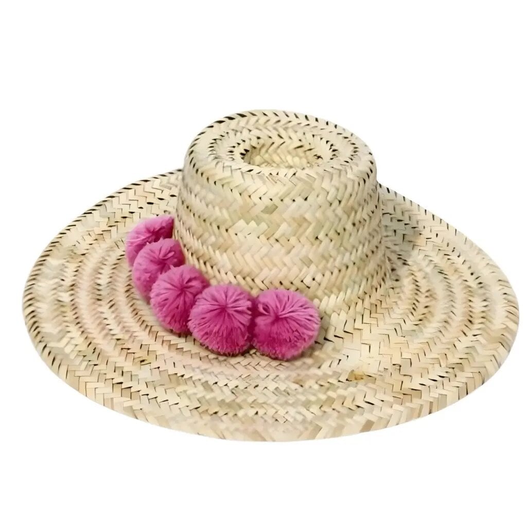 Handwoven straw beach hat with pink pompoms, wide brim Moroccan design, natural herringbone weave sun protection