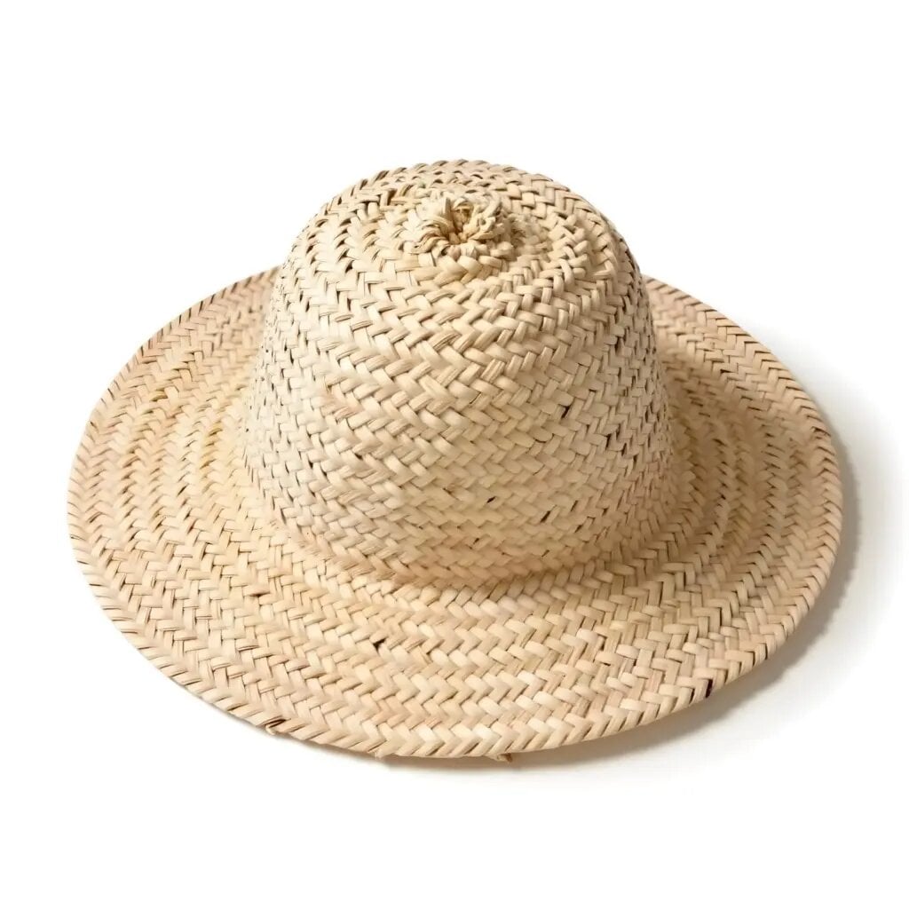 Handwoven straw hat with wide brim and spiral crown design in natural beige, Moroccan craftsmanship