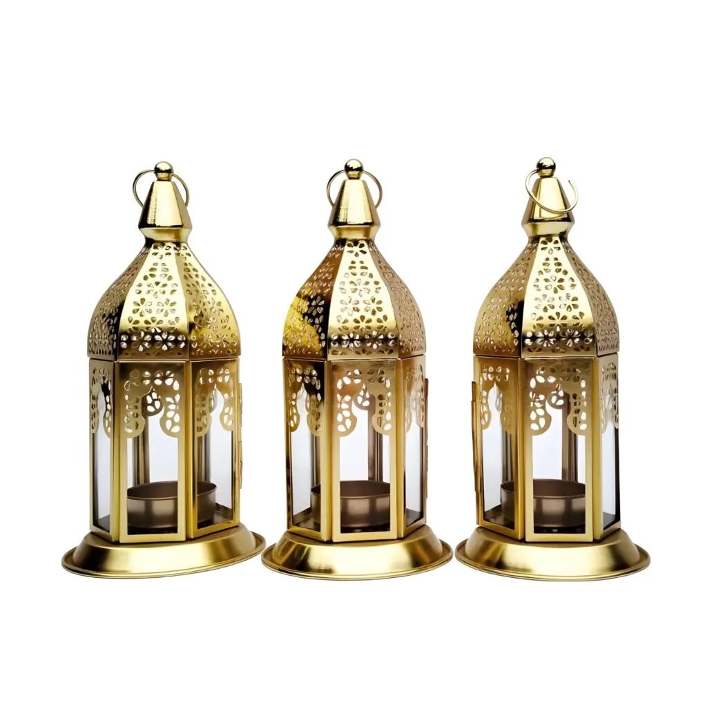 Set of 3 engraved brass candle holders with hexagonal design and ornate cutout patterns on white background
