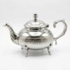 Diamond pattern silver teapot with domed lid, curved spout, and C-shaped handle on white background