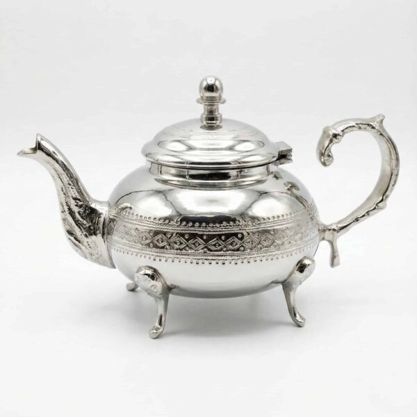 Diamond pattern silver teapot with domed lid, curved spout, and C-shaped handle on white background