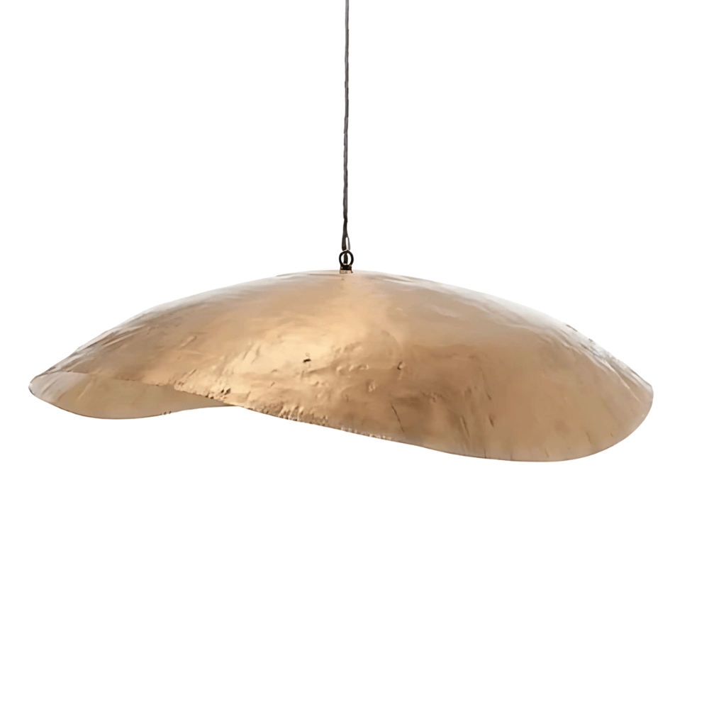 Hammered brass pendant light with organic curved shape and textured metalwork on white background