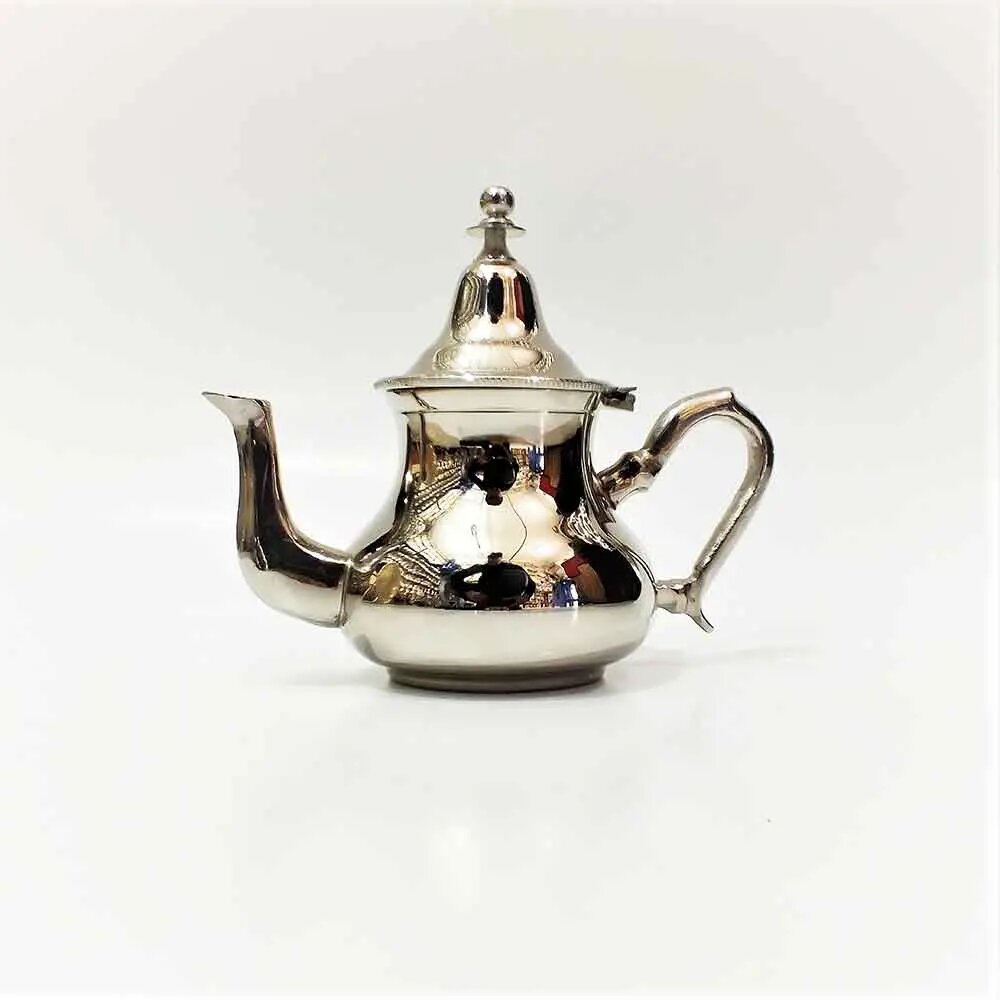 Plain polished silver teapot with tall conical lid, curved spout, and curved handle on off-white background