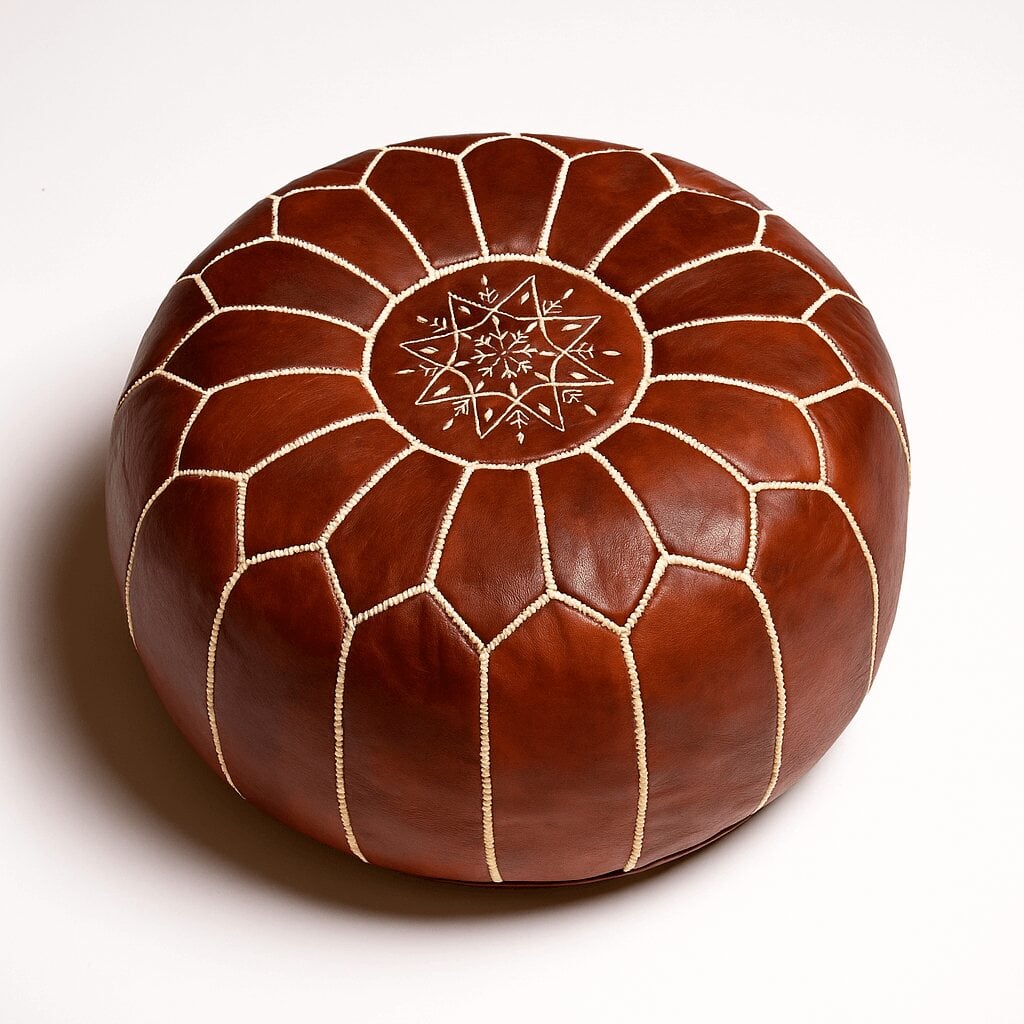 Brown leather round ottoman with embroidered geometric star pattern and hand-stitched central medallion