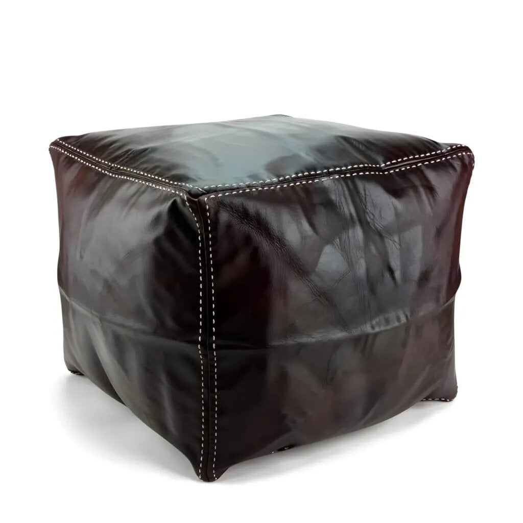 Dark brown square leather ottoman with cream contrast stitching on white studio background Dark brown square leather ottoman with cream contrast stitching on white studio background