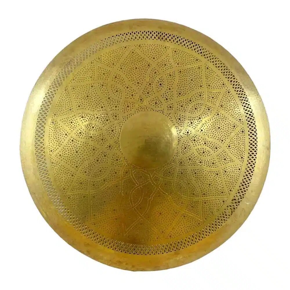 Hand-engraved round brass wall light in gold with intricate pierced geometric patterns and raised center detail