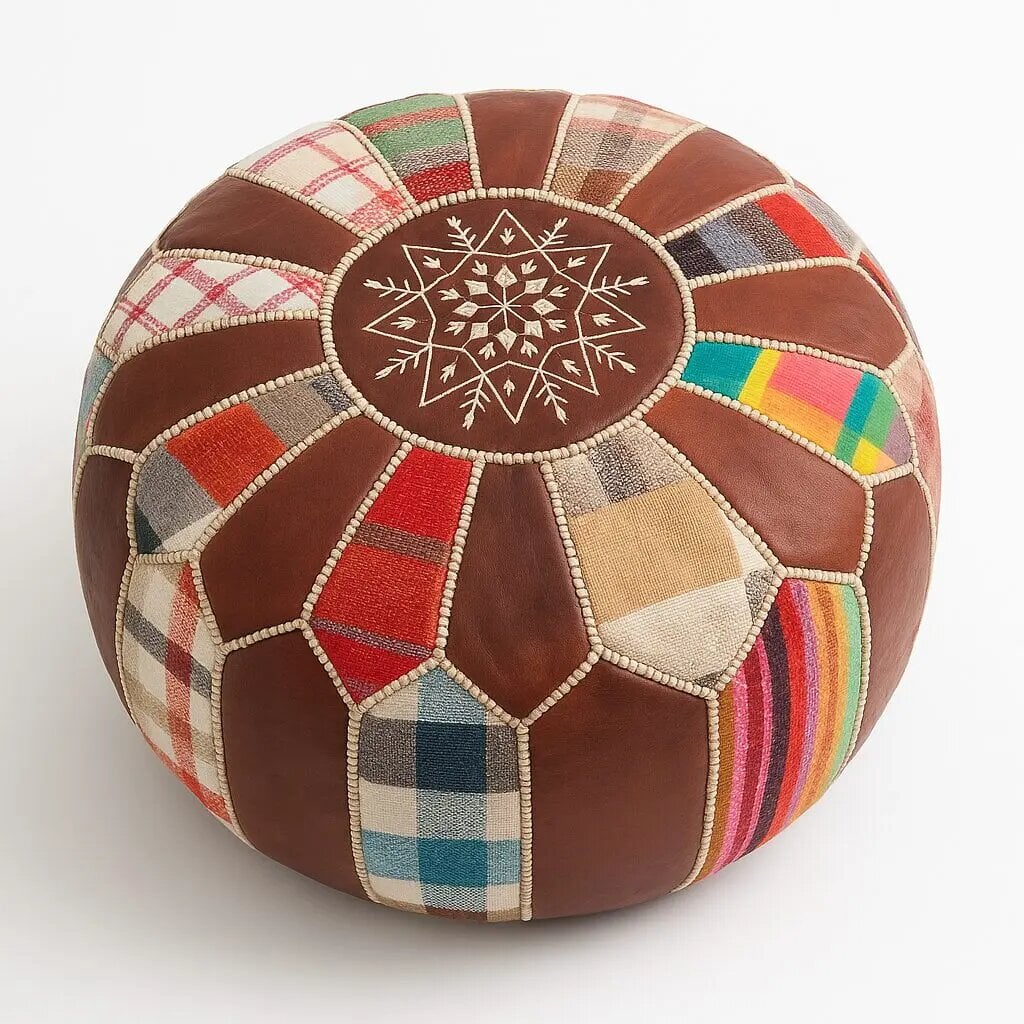 Patchwork leather round pouf with central embroidered star mandala and multicolor panels, top-down studio view