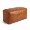 Handcrafted woven leather bench ottoman in light brown herringbone pattern on white background Handcrafted woven leather bench ottoman in light brown herringbone pattern on white background