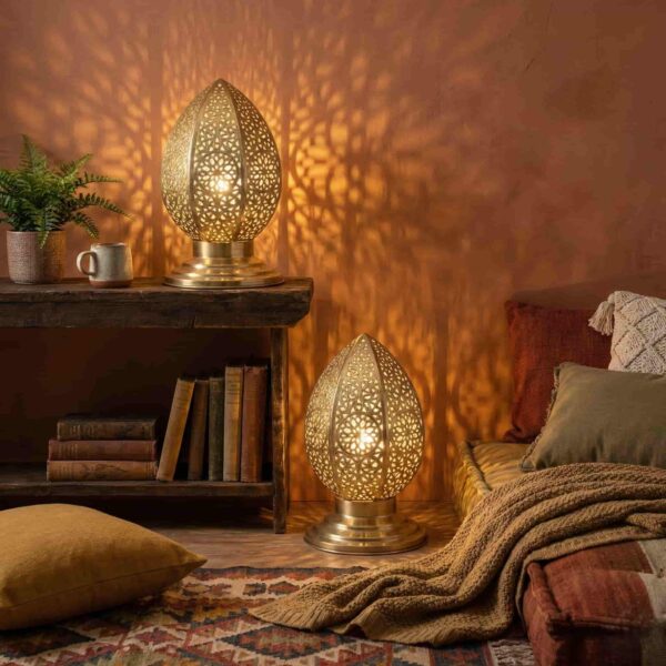 Brass filigree table lamps in bohemian living space creating warm ambient glow with decorative shadows Brass filigree table lamps in bohemian living space creating warm ambient glow with decorative shadows