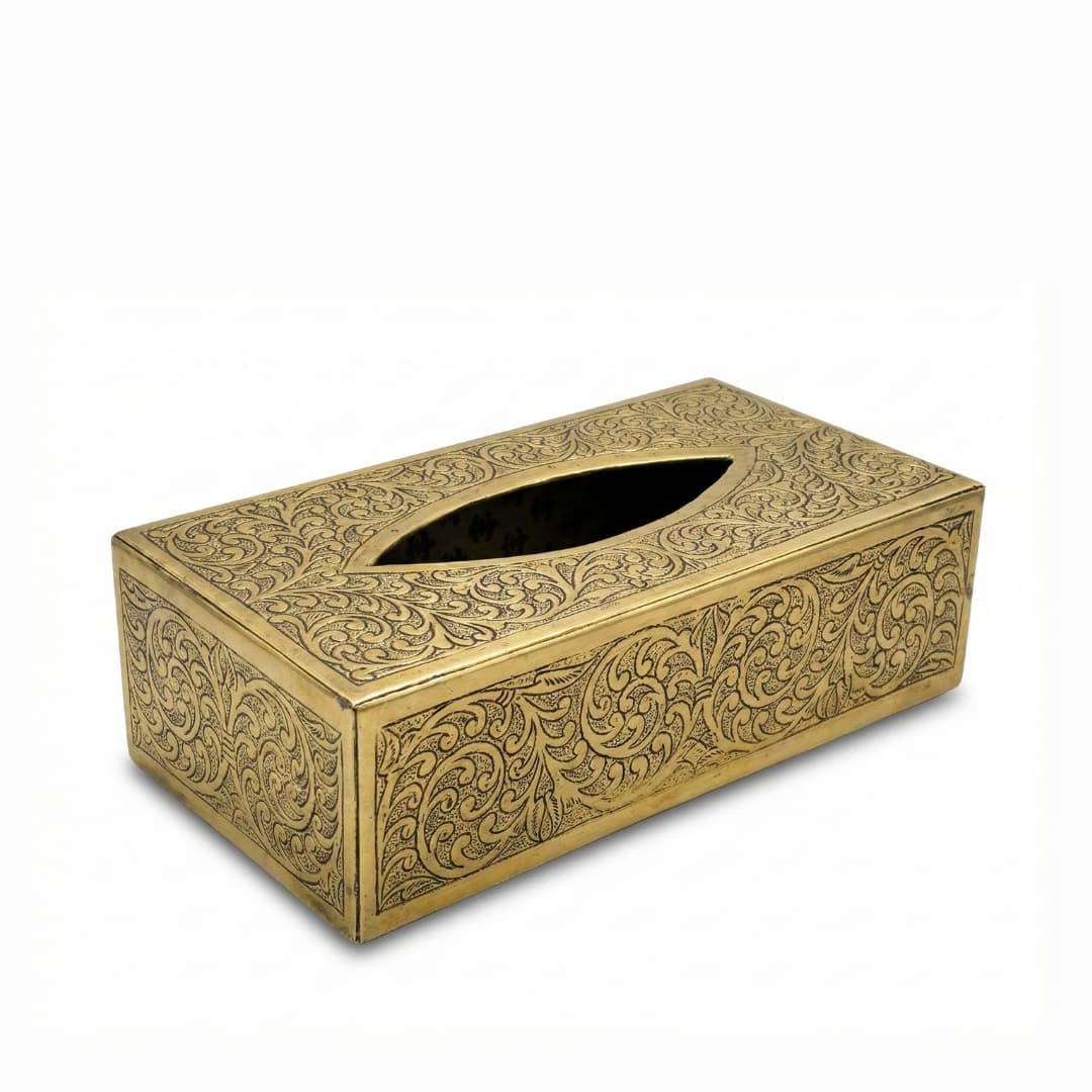 Hand-engraved gold brass tissue box cover with arabesque scrollwork pattern on white background