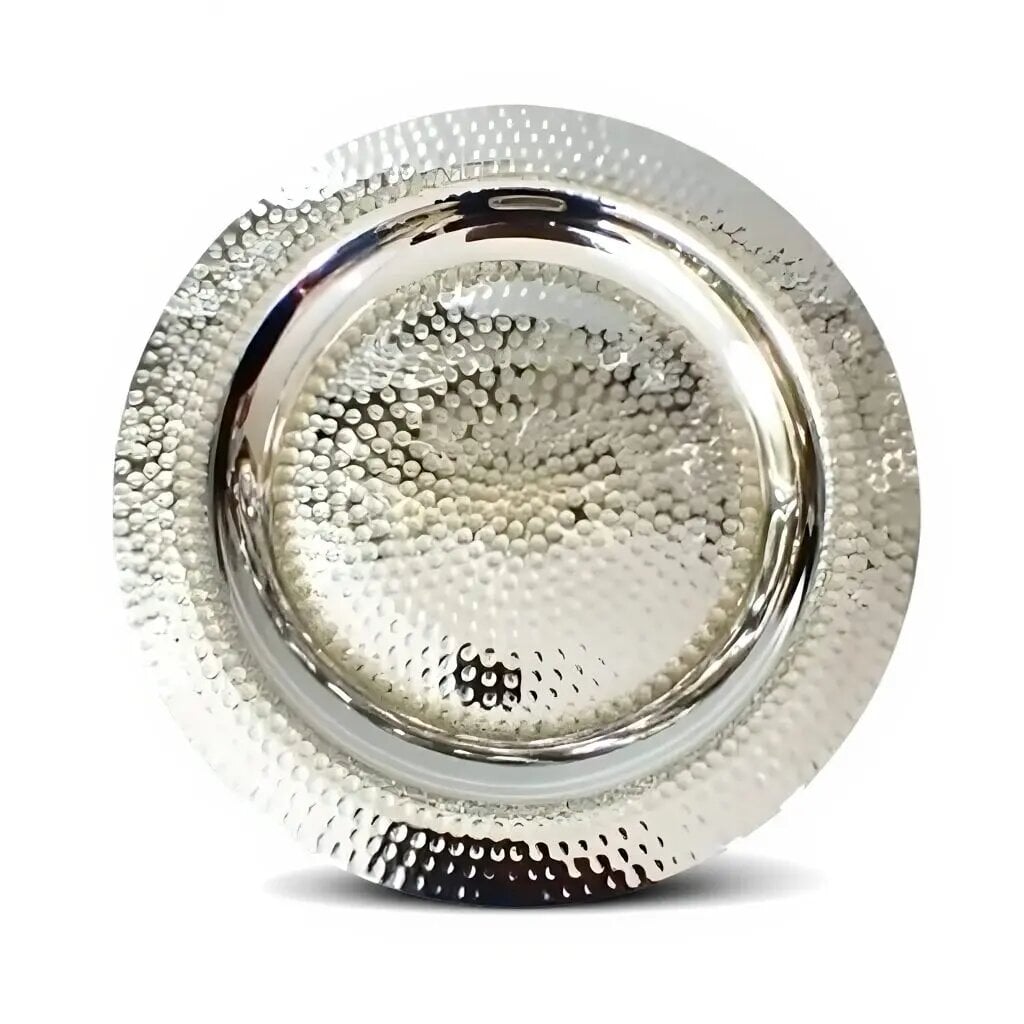 Round hand-hammered silver decorative tray with dimpled surface and raised rim on a white background Round hand-hammered silver decorative tray with dimpled surface and raised rim on a white background