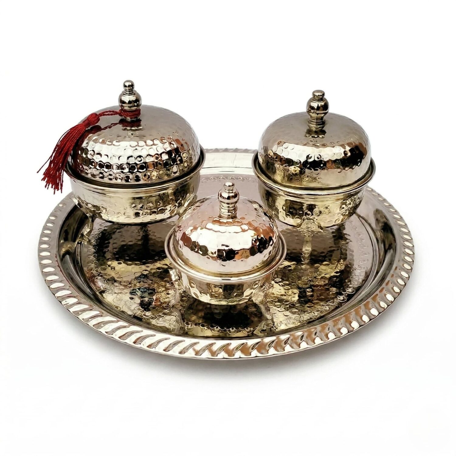 Hand hammered silver tea container service with three footed covered bowls on a matching ornate round Moroccan tray Hand hammered silver tea container service with three footed covered bowls on a matching ornate round Moroccan tray