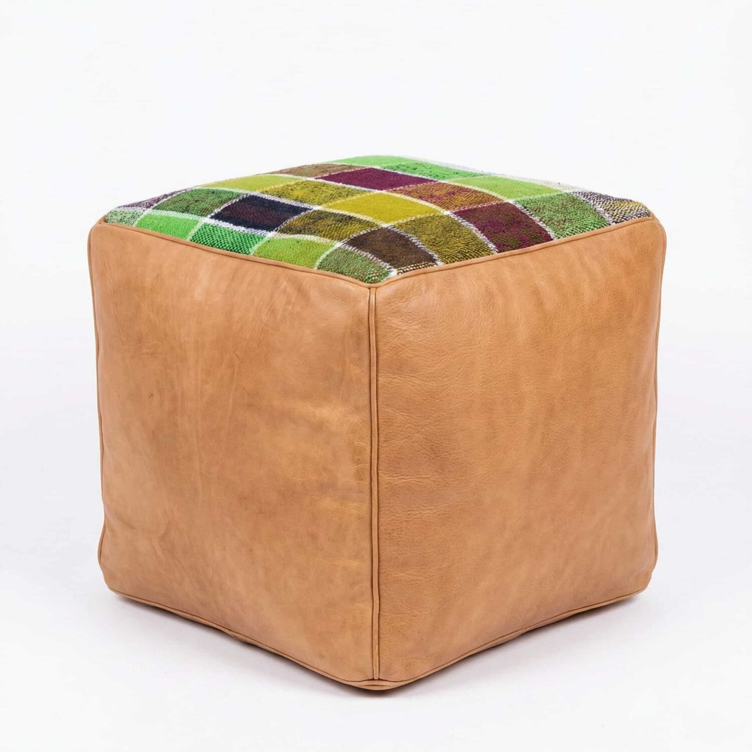 Handcrafted kilim cube ottoman in natural tan leather with multicolor geometric patchwork top on white background