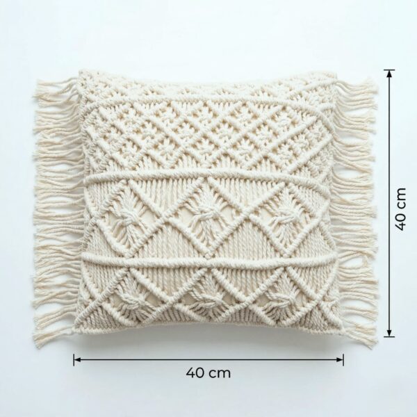 Macrame cushion cover flat lay showing 40cm by 40cm dimensions with hand-knotted geometric cotton pattern and fringe edg Macrame cushion cover flat lay showing 40cm by 40cm dimensions with hand-knotted geometric cotton pattern and fringe edges