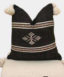 Black Moroccan kilim pillow cover with large ivory corner tassels and Berber motif