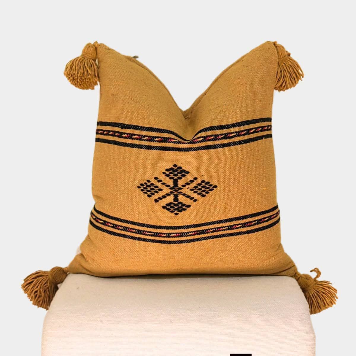 Mustard Moroccan kilim pillow cover with large wool corner tassels and Berber motif