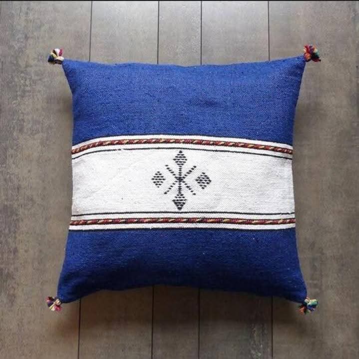 Handwoven Moroccan kilim pillow cover in royal blue with a white central band and Berber motif