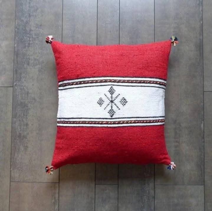 Handwoven Moroccan kilim pillow cover in red with a white central band and Berber motif