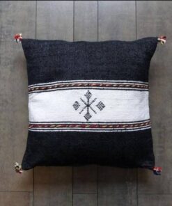 Handwoven Moroccan kilim pillow cover in black with a white central band and Berber motif