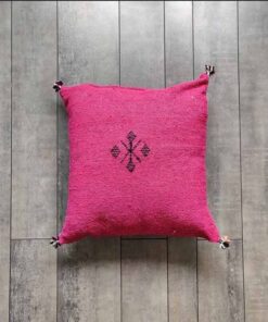 Handwoven Moroccan kilim pillow cover in fuchsia with Berber motif and pompom corners